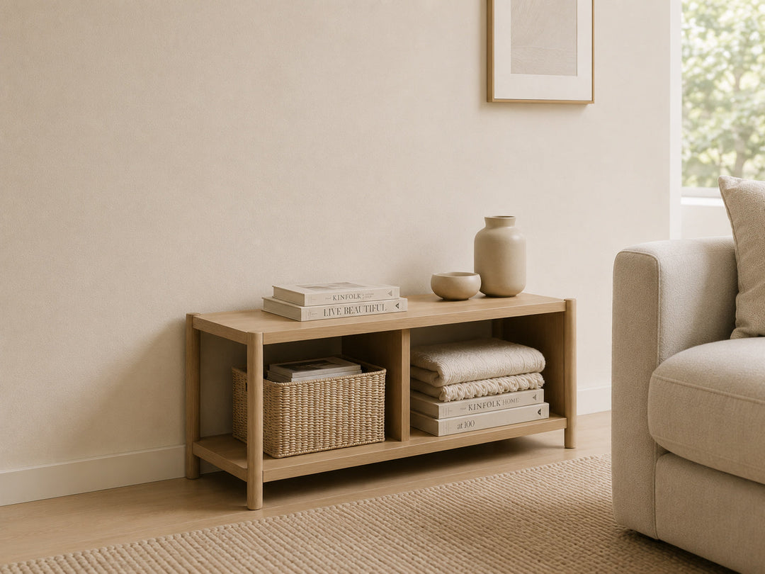 Organised living room with a light oak storage console and woven basket