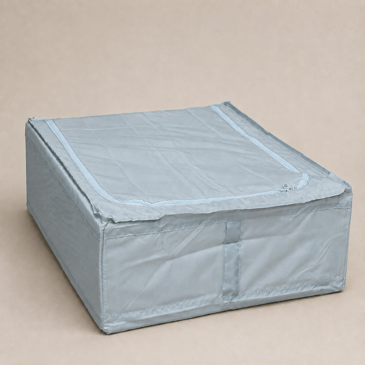 Light blue foldable under-bed storage organizer with zipper top and front handle