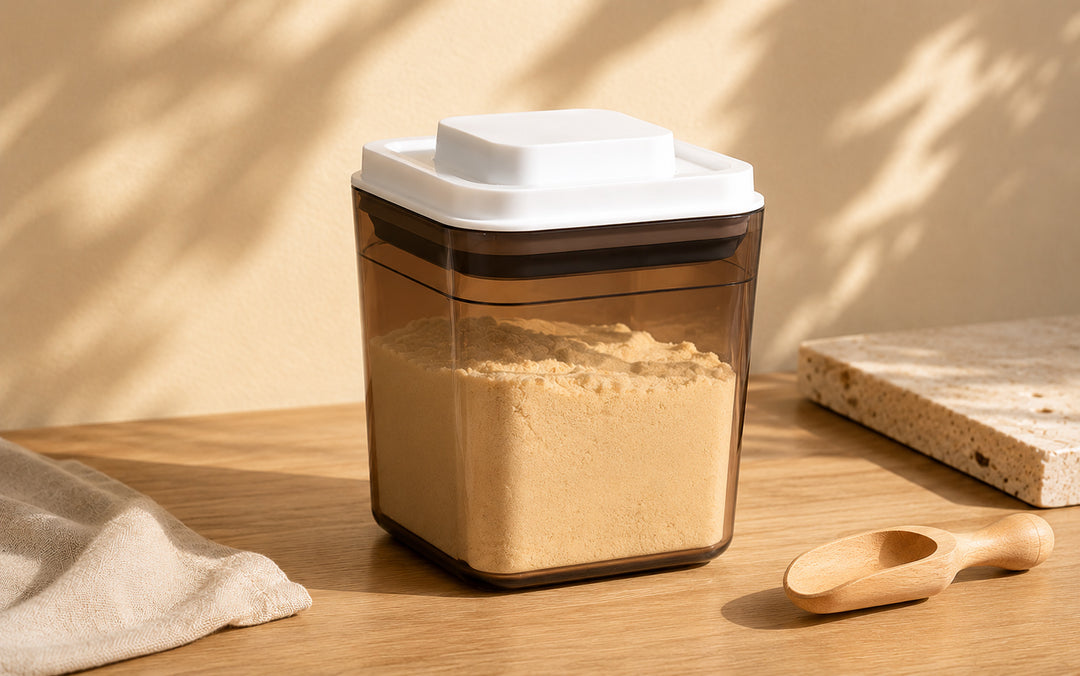 Amber food storage container designed to help reduce light exposure for dry pantry ingredients