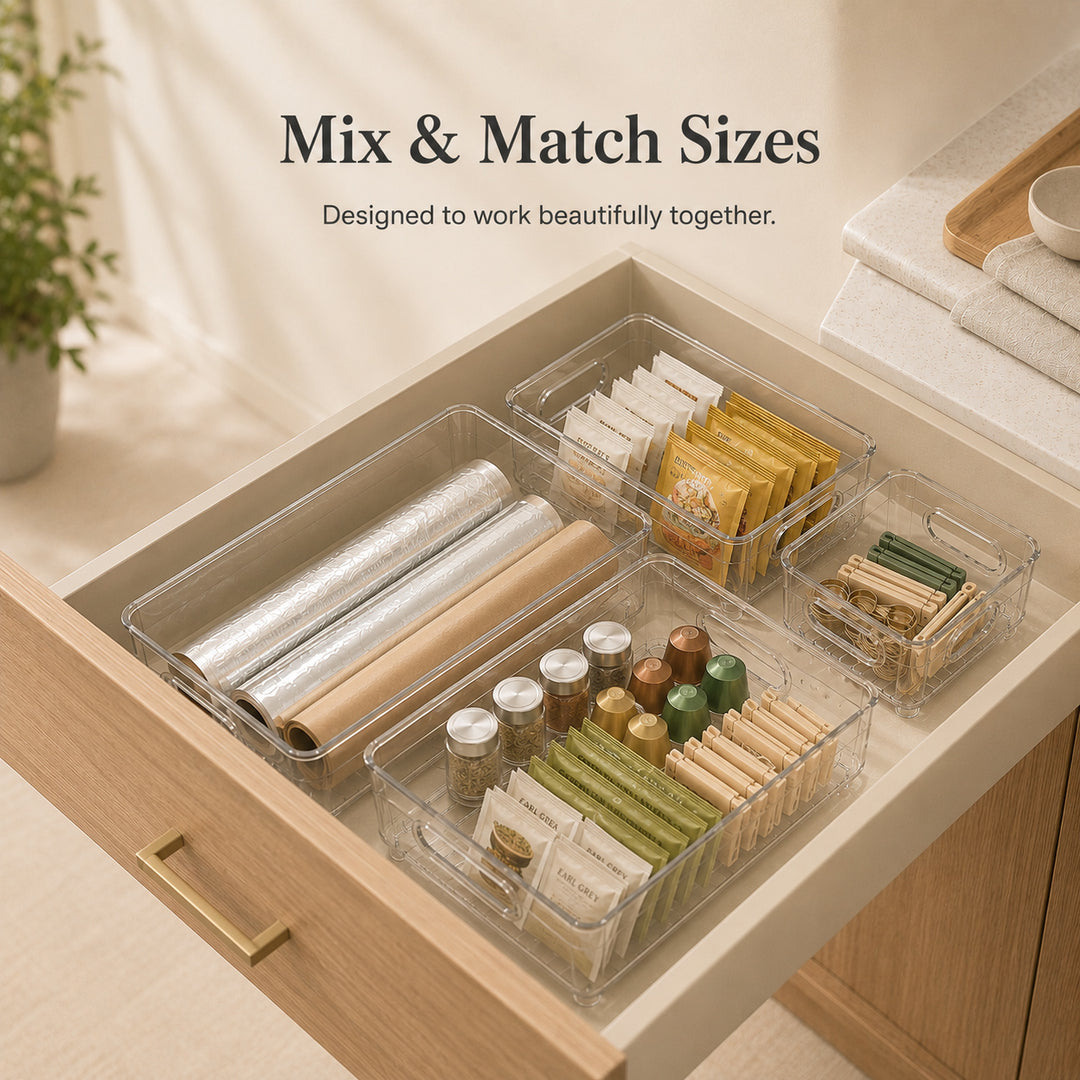 Clear Drawer Organizer in multiple sizes working together to organise a modern kitchen drawer.