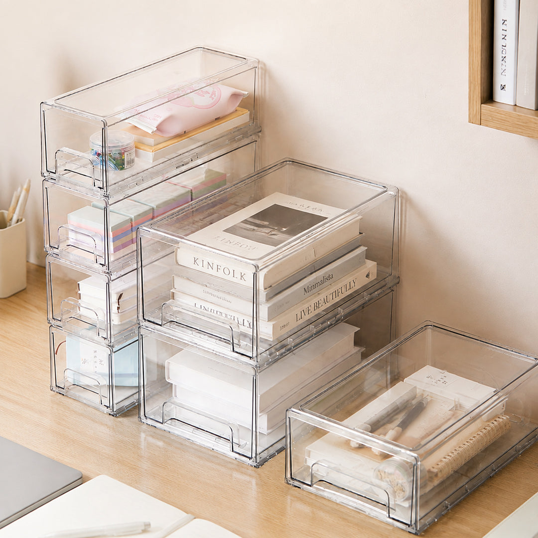 Clear stackable storage drawers helping organise books, stationery, and office essentials