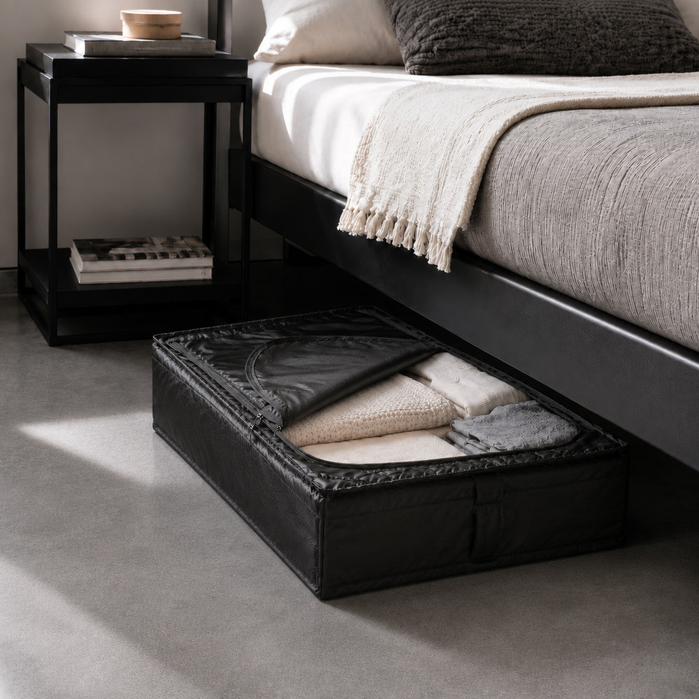 Foldable under-bed storage organizer partially pulled out with folded bedding and seasonal clothes