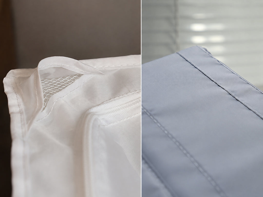 Close-up of the corner mesh ventilation opening and stitched seams on the foldable under-bed storage organizer