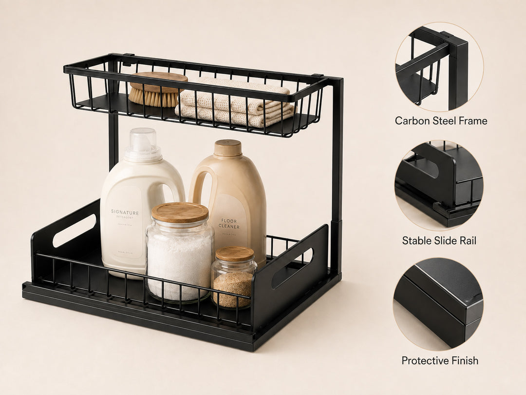 A black two-tier wire storage organizer with integrated handles, shown holding laundry detergent, jars, and folded towels on a warm beige background. Three circular inset callouts on the right highlight the carbon steel frame, stable slide rail, and protective finish, with text labels.