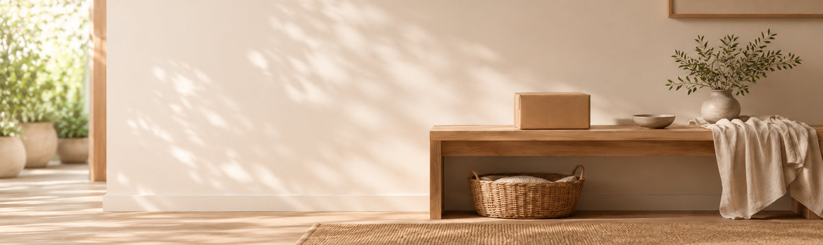 Warm modern entryway with a parcel on a light oak bench